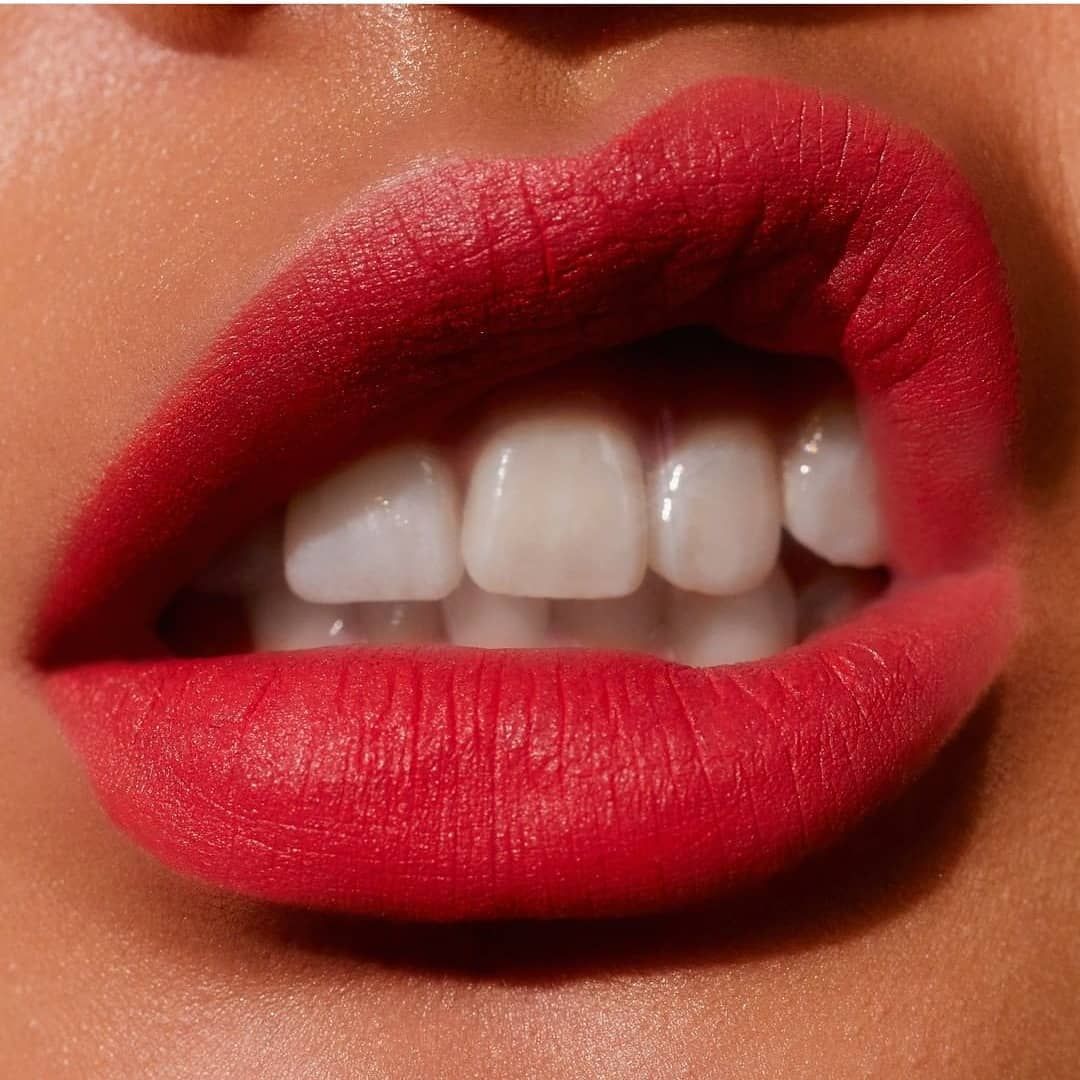 A Close Up Of A Woman 's Lips With Red Lipstick And White Teeth — Envy Cosmetic Collective in Maitland, NSW
