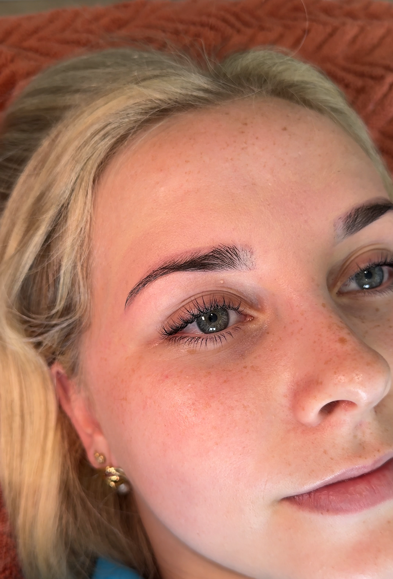 Woman Having Eye Lashes Tinted In Beauty Salon — Envy Cosmetic Collective in Maitland, NSW