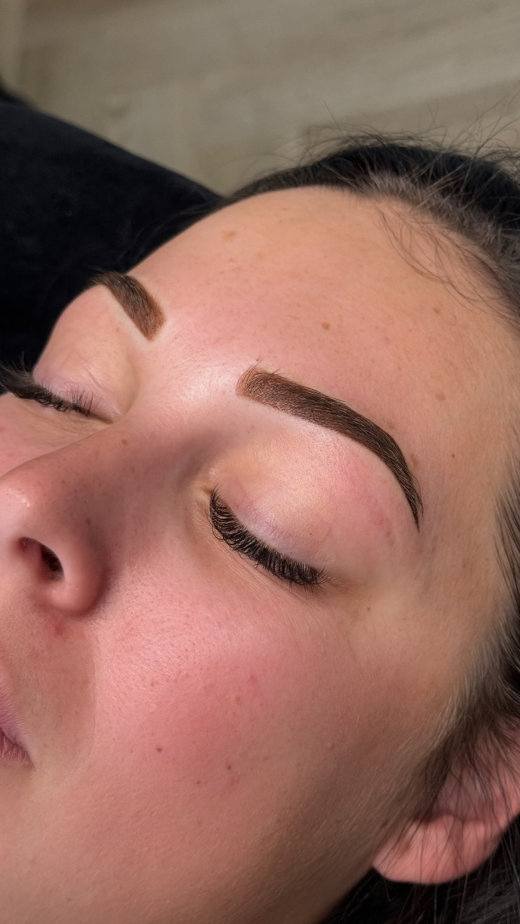 a woman's face with her eyes closed — Envy Cosmetic Collective in Maitland, NSW