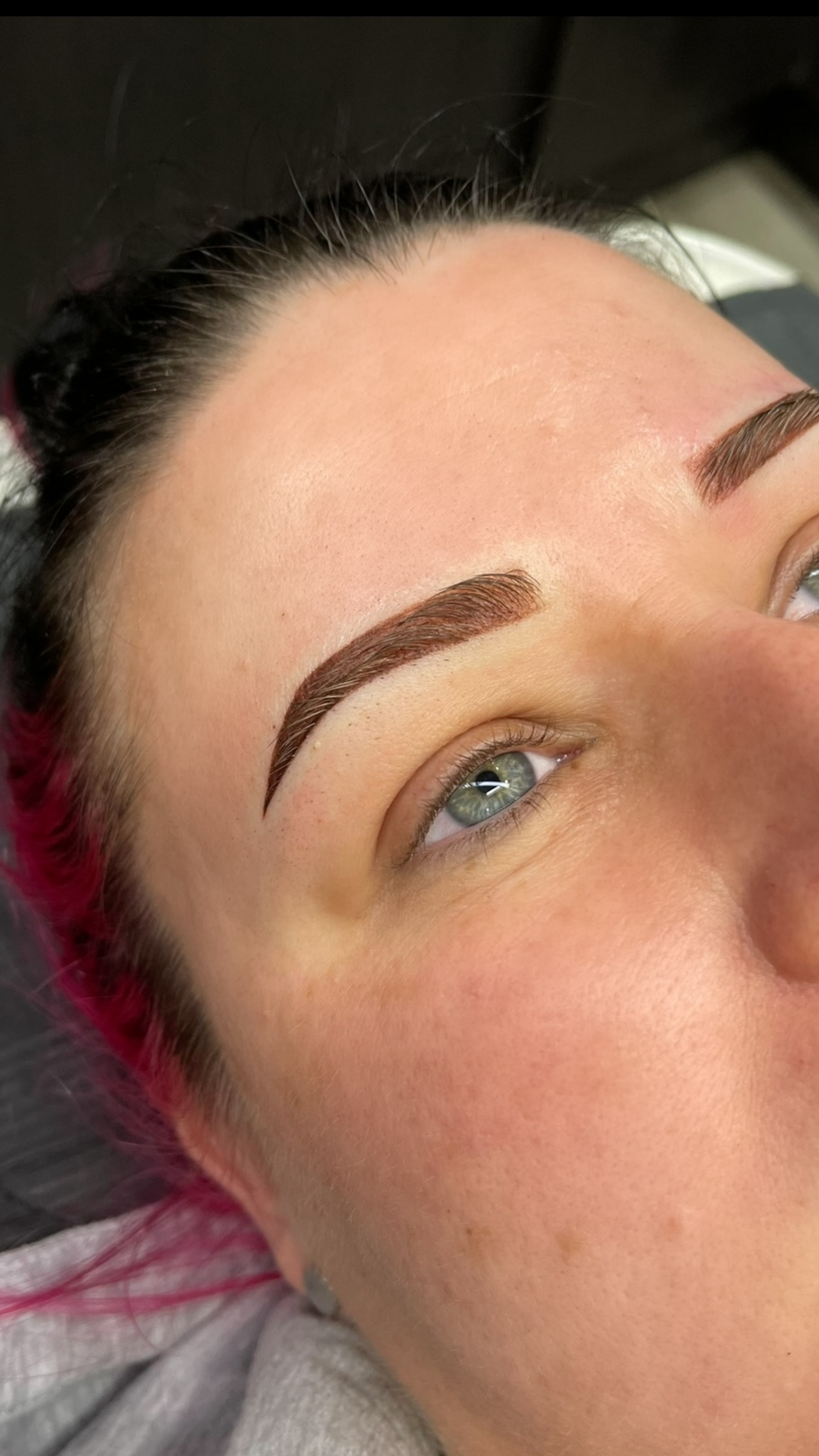 woman with eye open and tattooed brow 
— Envy Cosmetic Collective in Maitland, NSW