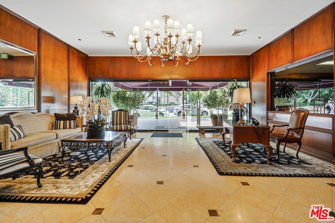 A living room with a chandelier and a couch