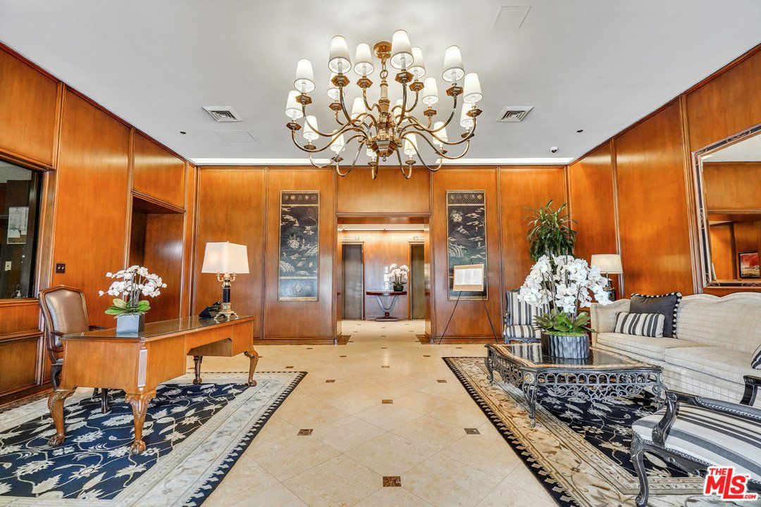 There is a chandelier in the middle of the room.
