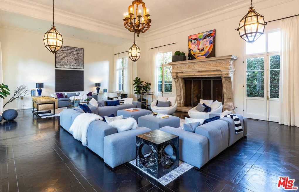 A living room filled with furniture and a fireplace.