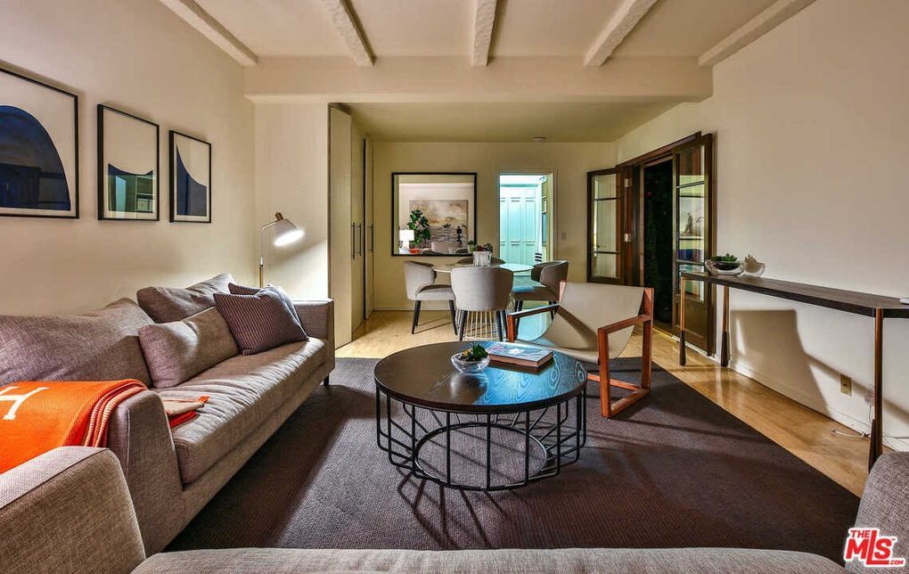 A living room with a couch and a coffee table