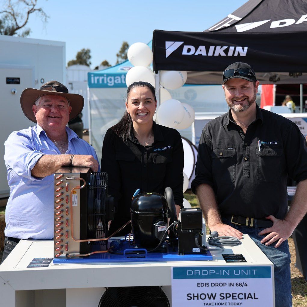 A Group of People Standing in Front of a Daikin Tent — Chill-Rite Refrigeration and Air Conditioning in Dubbo, NSW