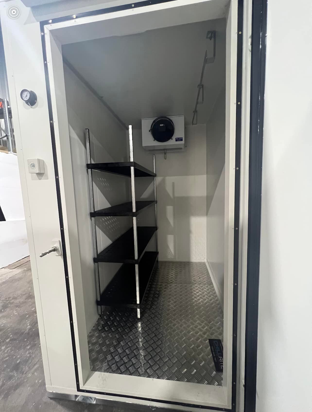 A Room With a Door Open and Shelves in It — Chill-Rite Refrigeration and Air Conditioning in Dubbo, NSW