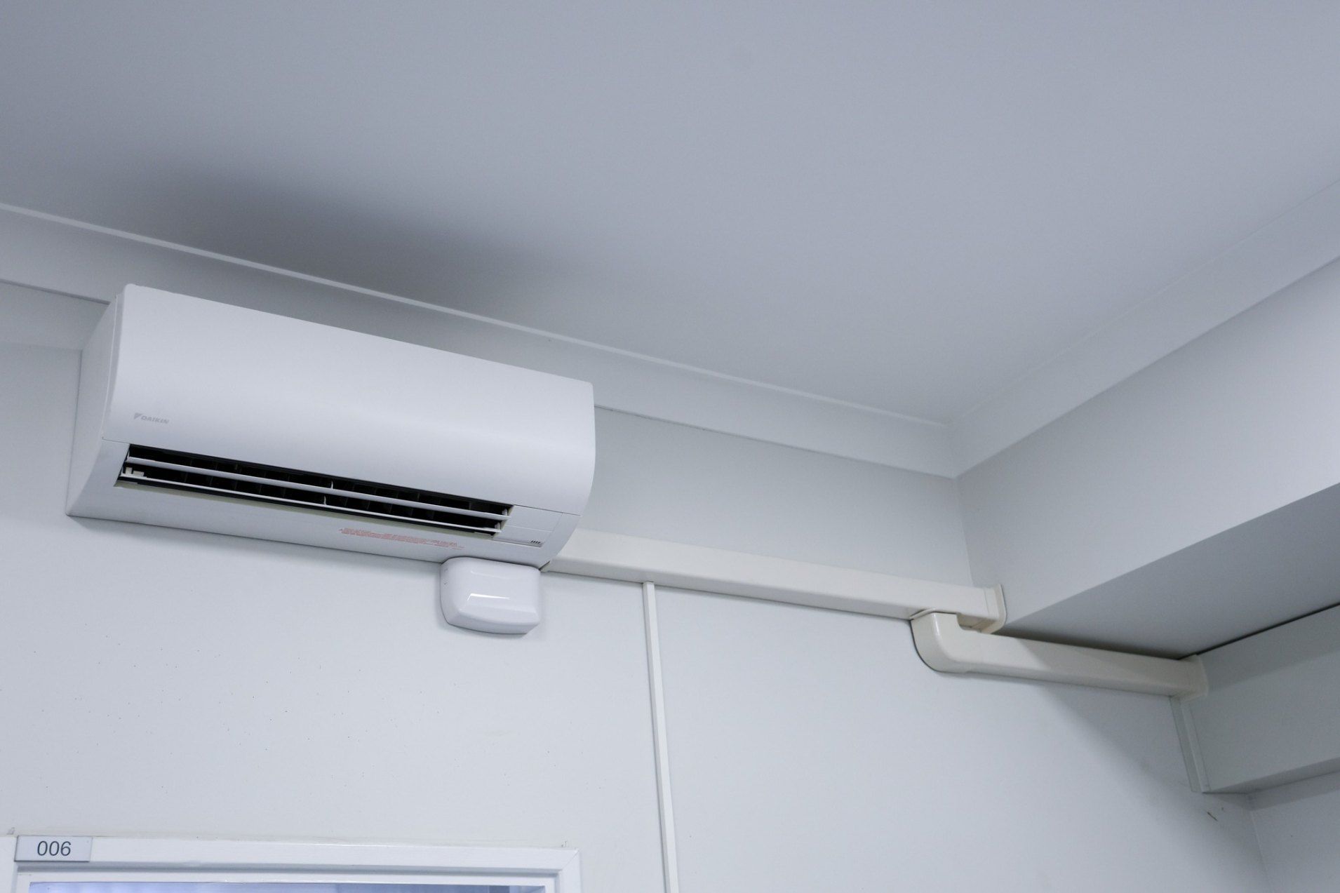 A White Air Conditioner is Hanging From the Ceiling of a Room — Chill-Rite Refrigeration and Air Conditioning in Mudgee, NSW