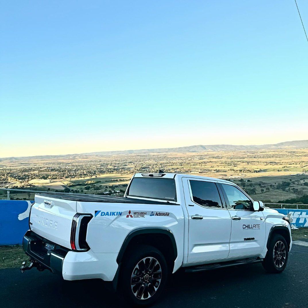 A White Truck is Parked on the Side of the Road — Chill-Rite Refrigeration and Air Conditioning in Parkes, NSW