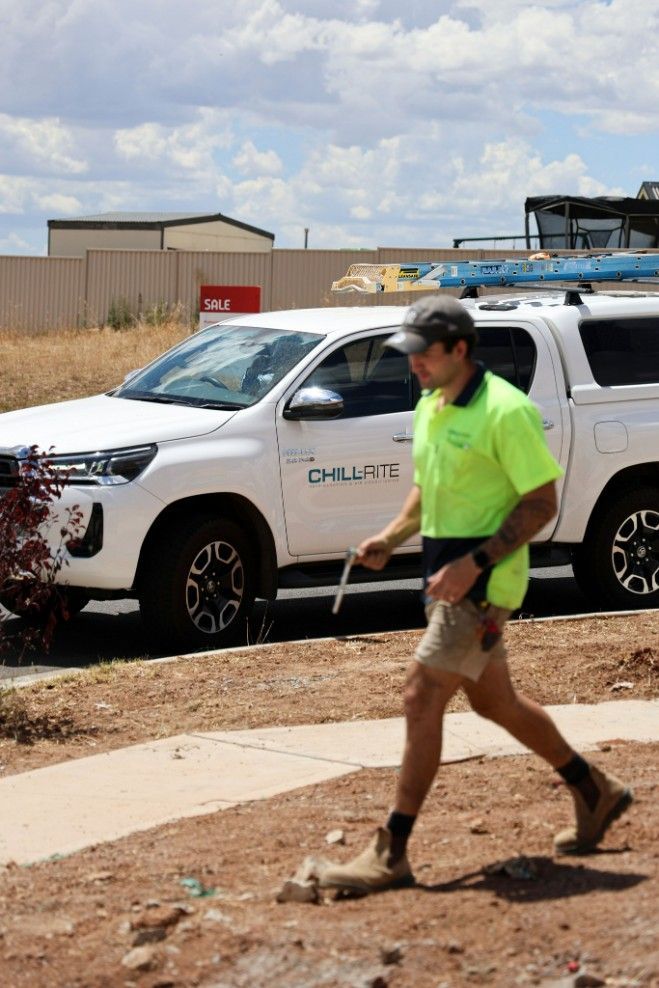 A Chill-Rite Truck With Man Passing By
