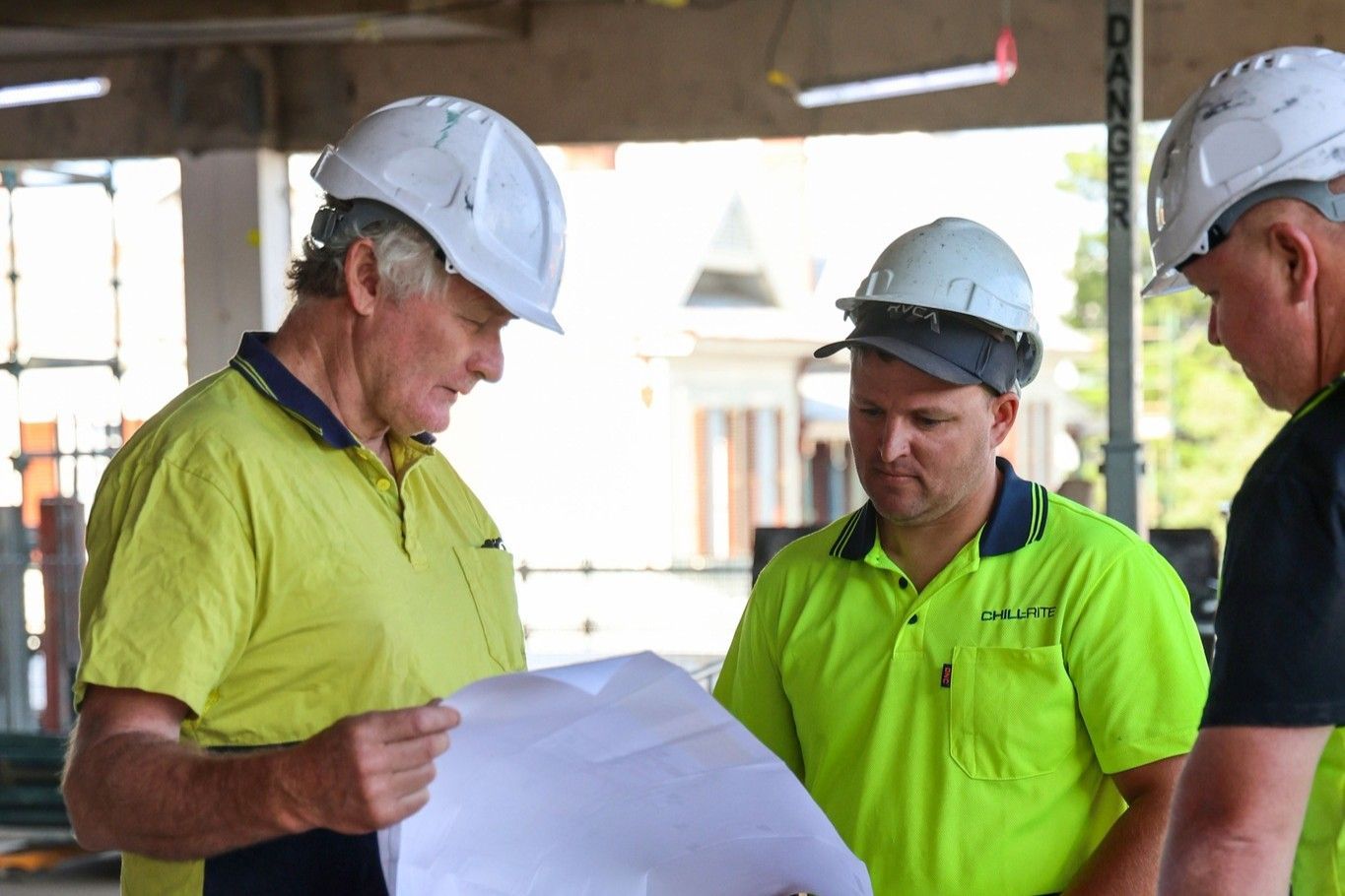 People Discussing The Air Conditioning System Of A Building