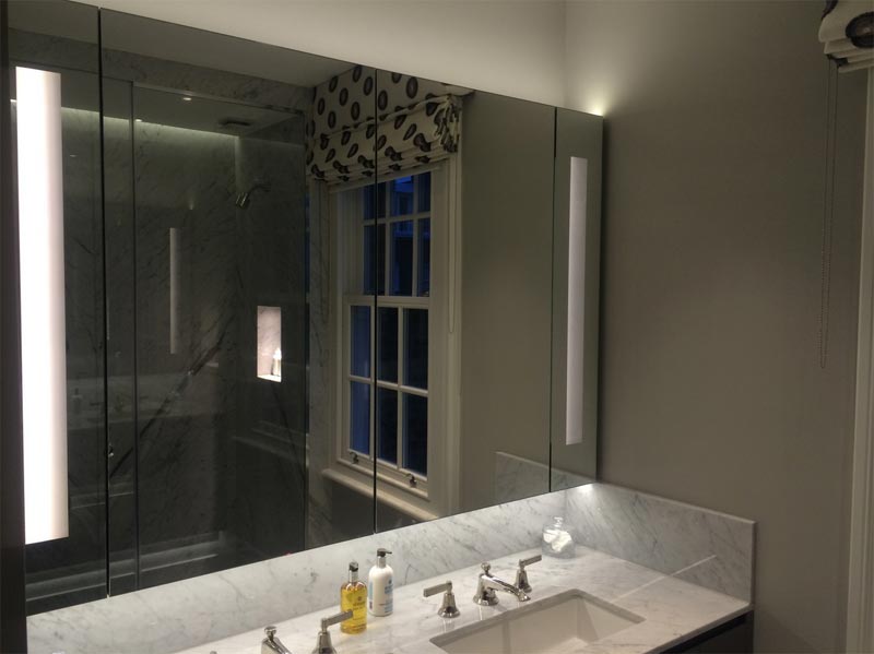 large glass covering wall in bathroom