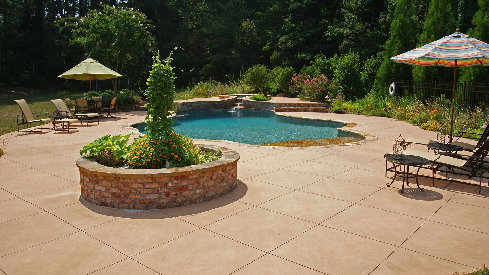 A large swimming pool surrounded by chairs and umbrellas