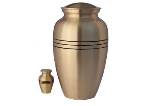 Brass urn with matching small keepsake urn on a white background