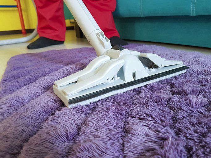 vacuum on purple rug