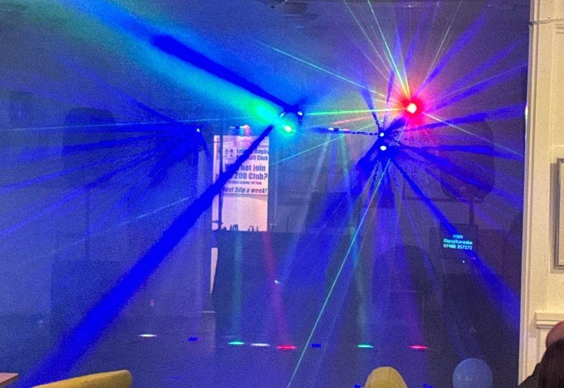 A room with a lot of lights on the ceiling.