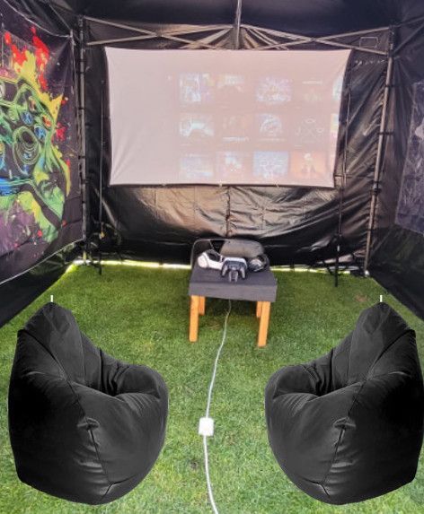 Two bean bag chairs in front of a projector screen