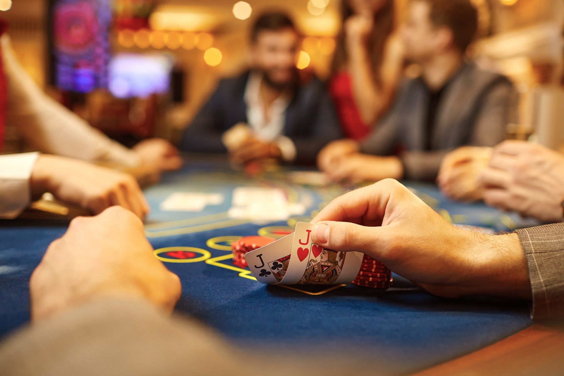 People play poker at the table in the casino.