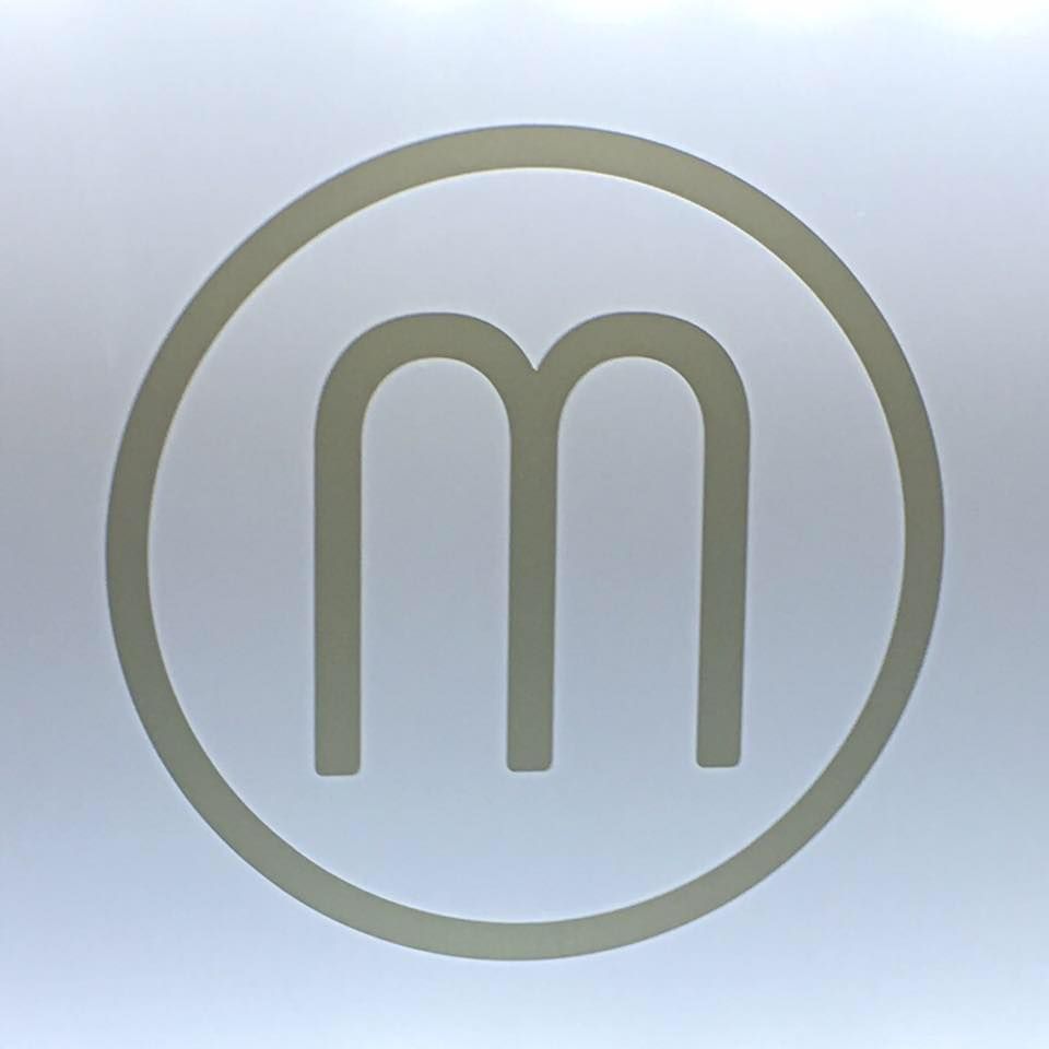 A light-colored circle containing the letter 