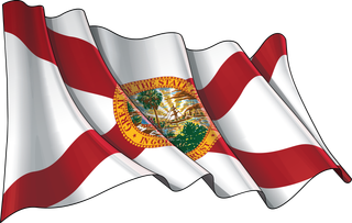 A florida state flag is waving in the wind