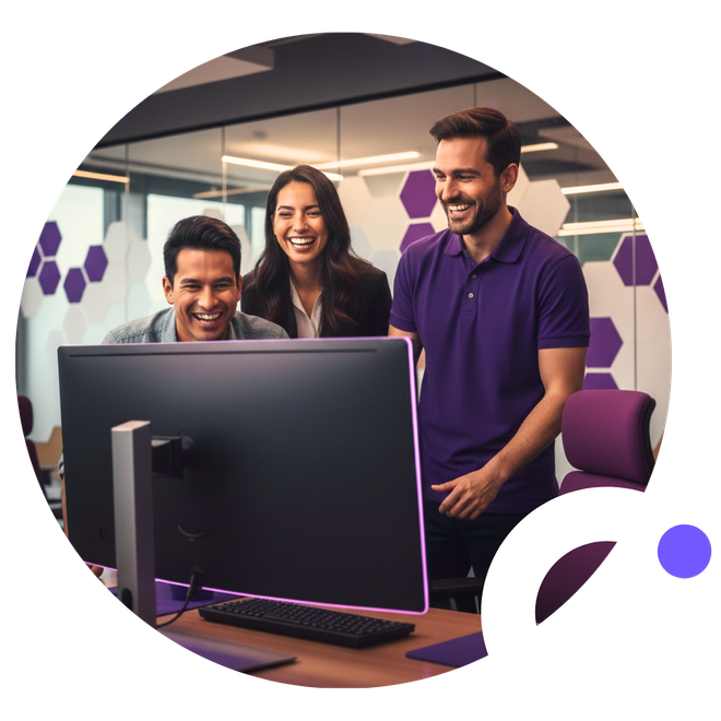 Three colleagues smiling at a computer screen in an office, purple accents.