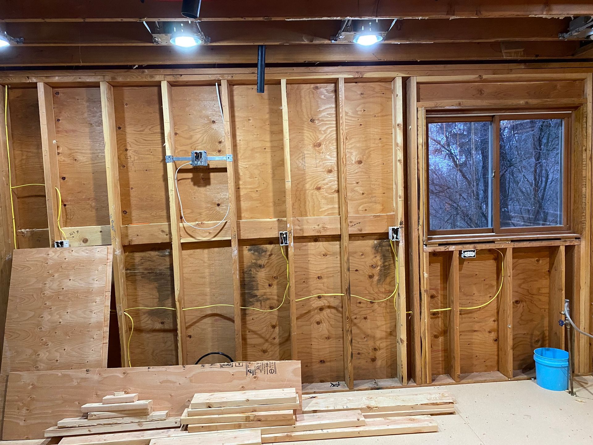 A person is installing a light switch on a wall.