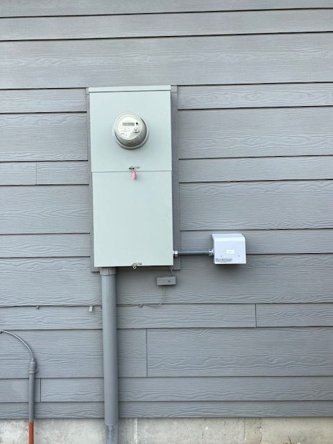 A close up of a electrical box with lots of wires and meters.
