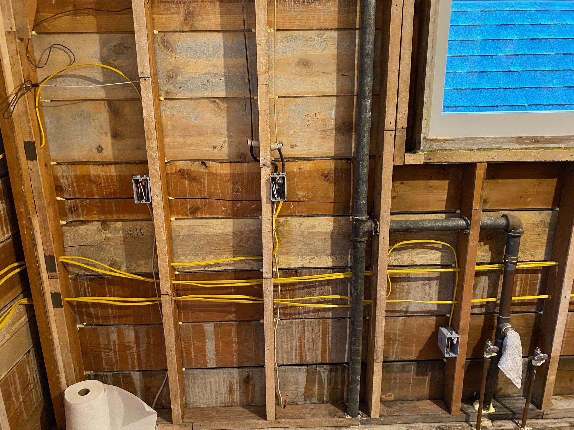 A close up of a electrical box with lots of wires and meters.