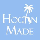 A logo for hogin made with a palm tree on a blue background