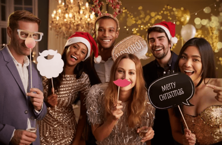 Christmas holiday party using our themed props and classic photo booth rental.