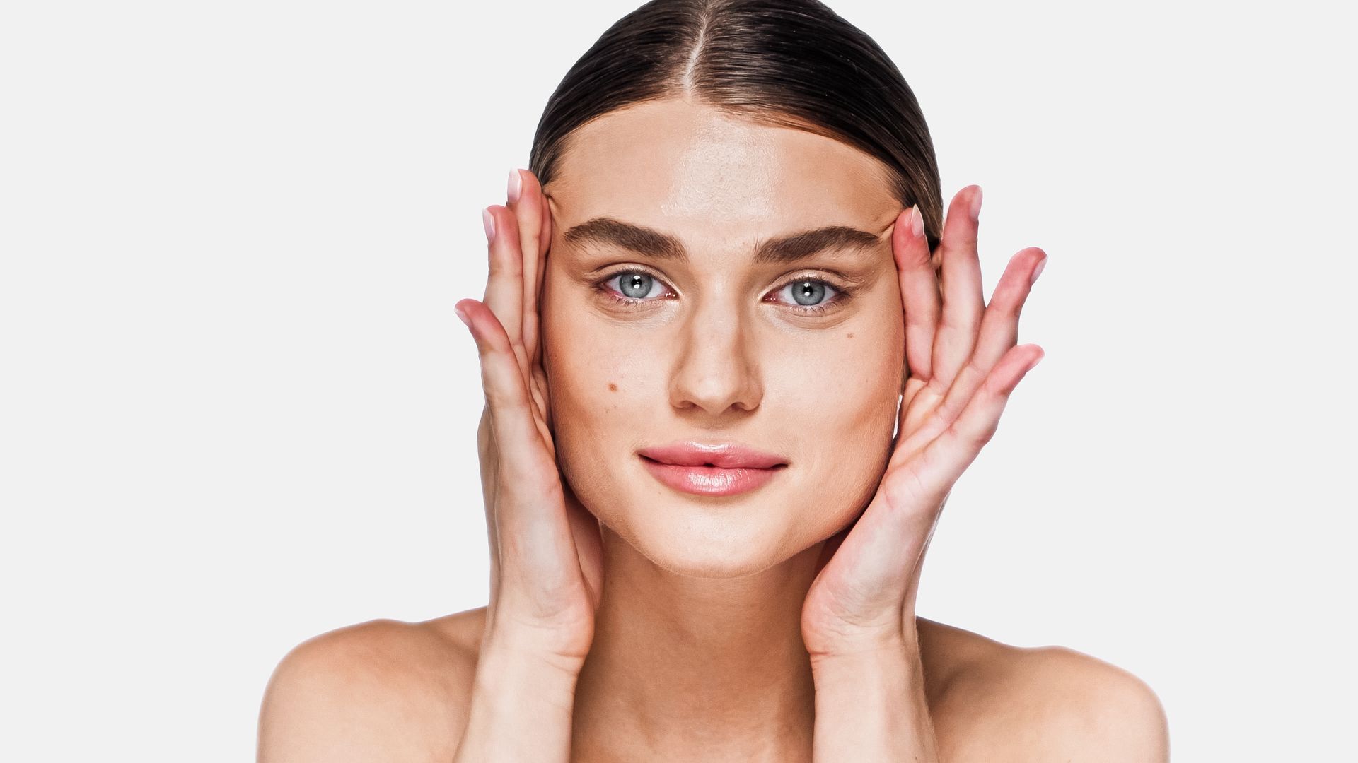 A man with a beard is getting a botox injection in his face.