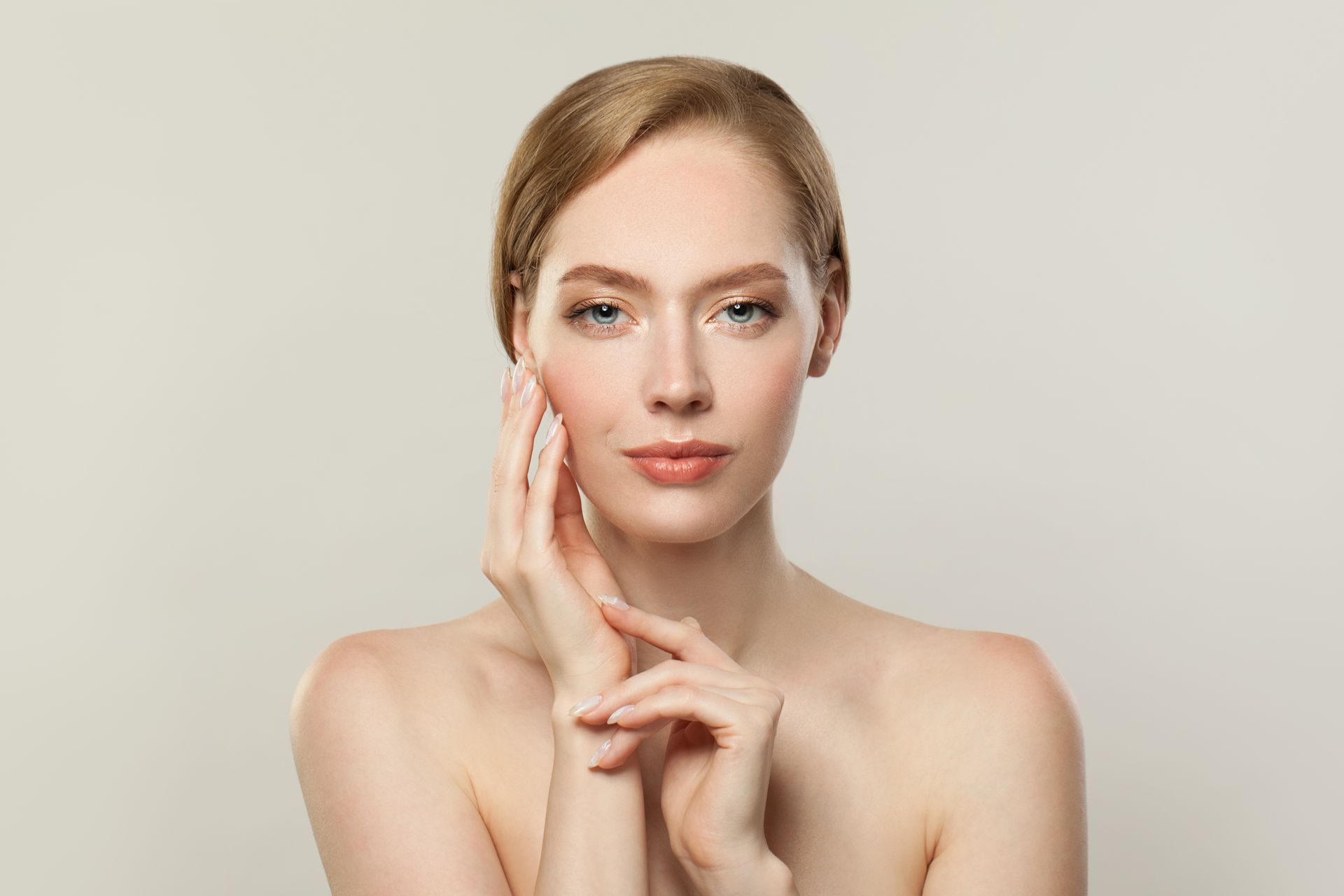 A man with a beard is getting a botox injection in his face.