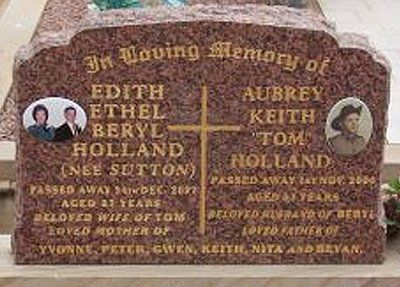 cut in gold lettering on calca red granite headstone
