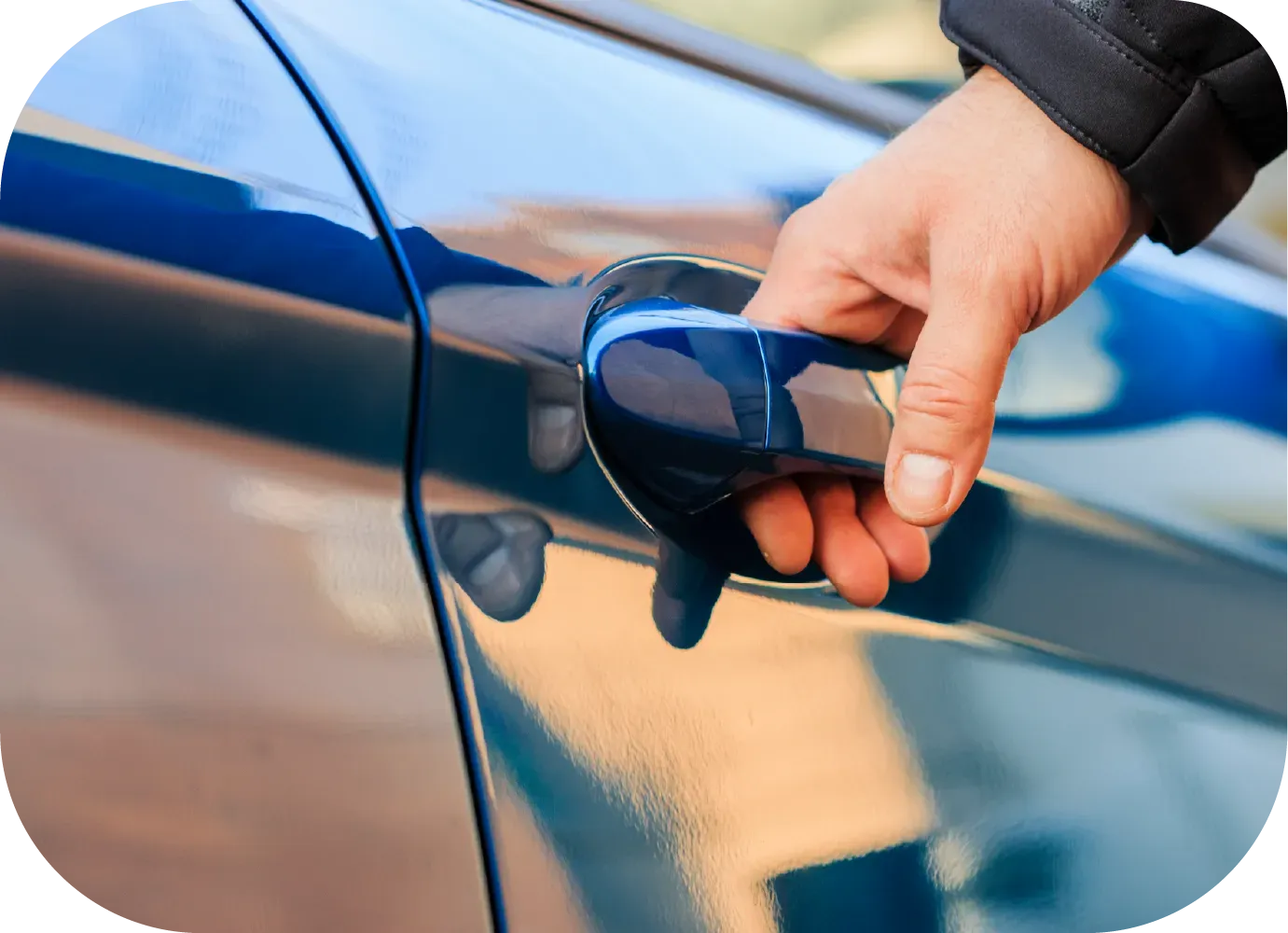 Hands of an electrician wiring a light switch, with visible colored wires and a wall outlet box.