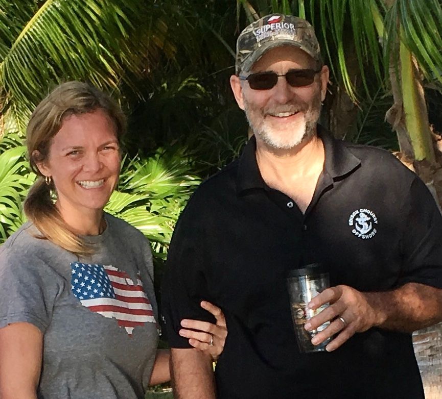 A man and a woman are posing for a picture