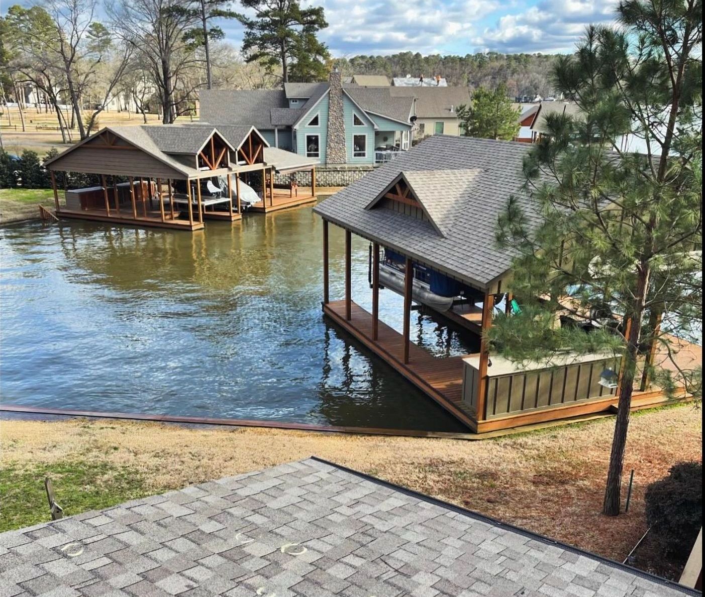 A large body of water with a house in the background