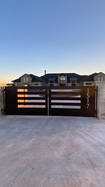 A large house with a large gate in front of it