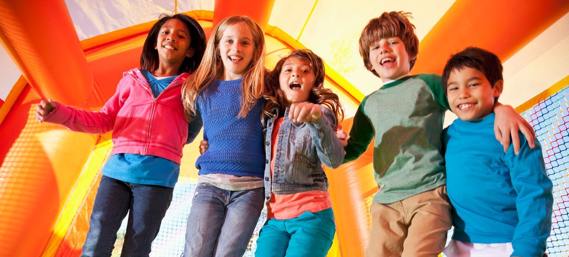 Children on a playground laughing.