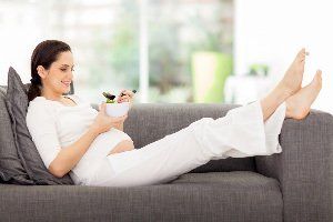 Pregnant Woman Relaxing While Eating — A Child's Dream