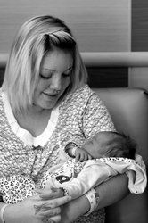 Woman Holding A New Born Child — A Child's Dream