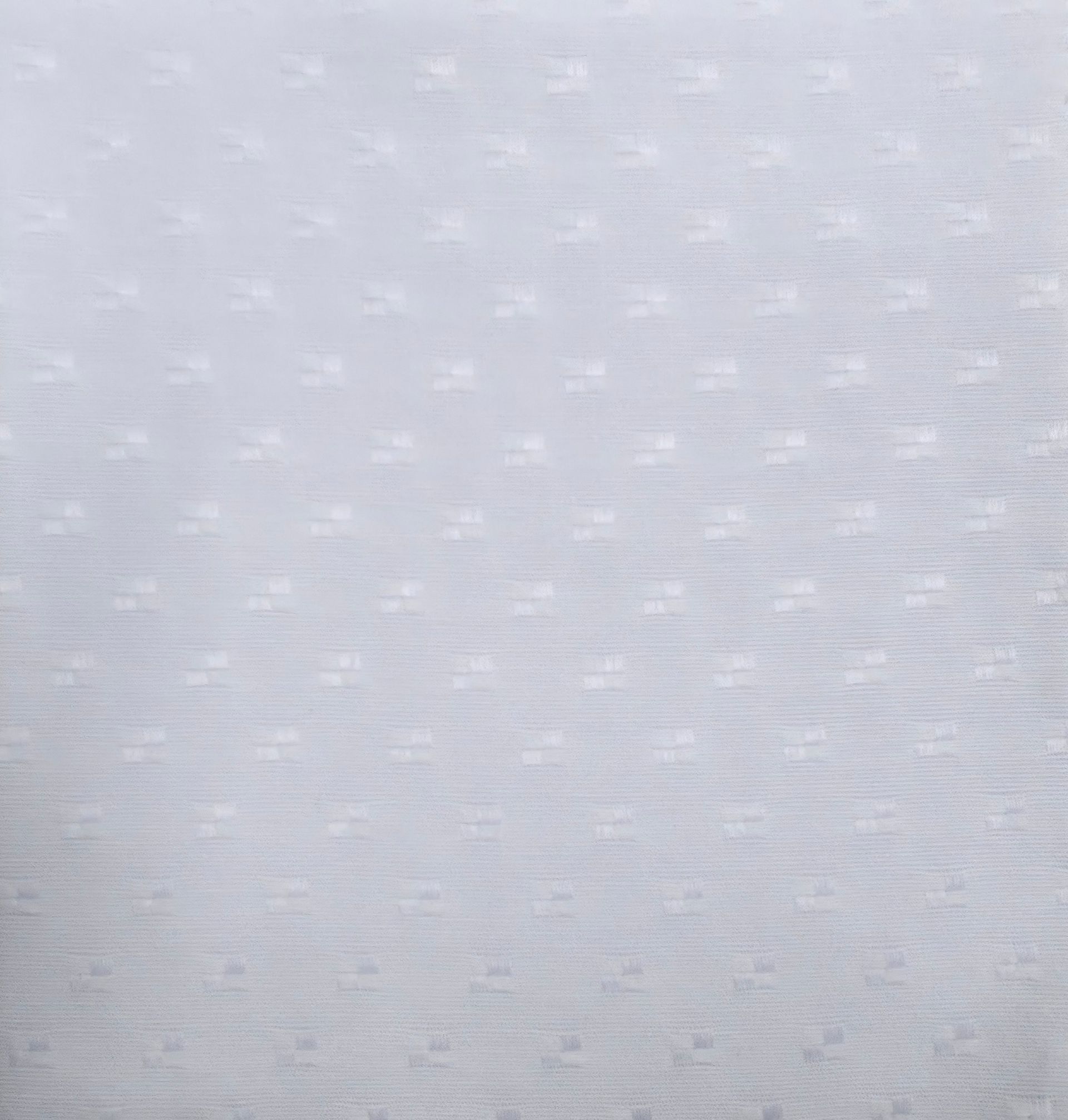 Un primer plano de un trozo de tela color melocotón.