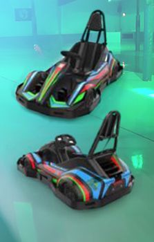 Two go karts are parked next to each other on a concrete floor.
