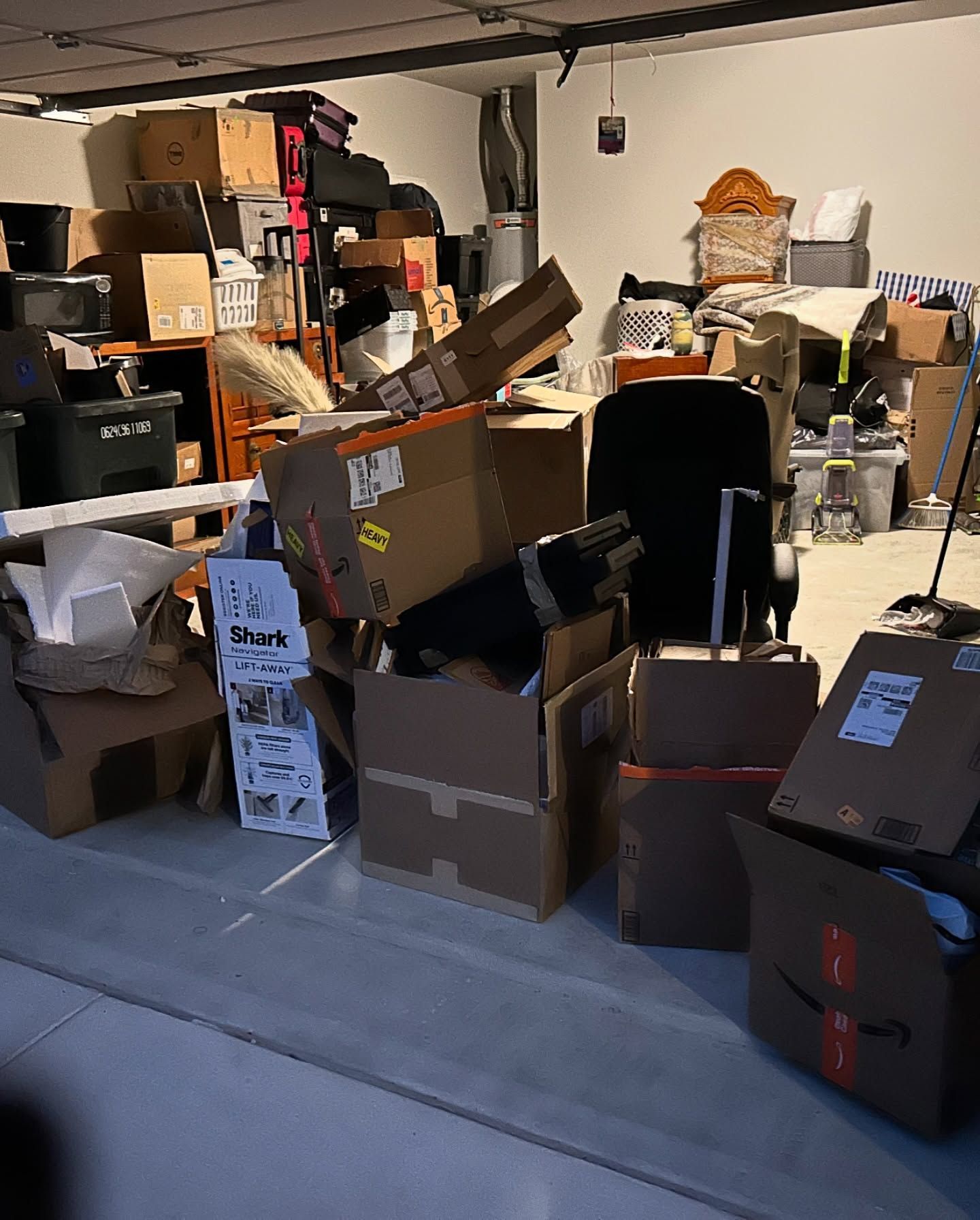 A garage filled with lots of boxes and luggage