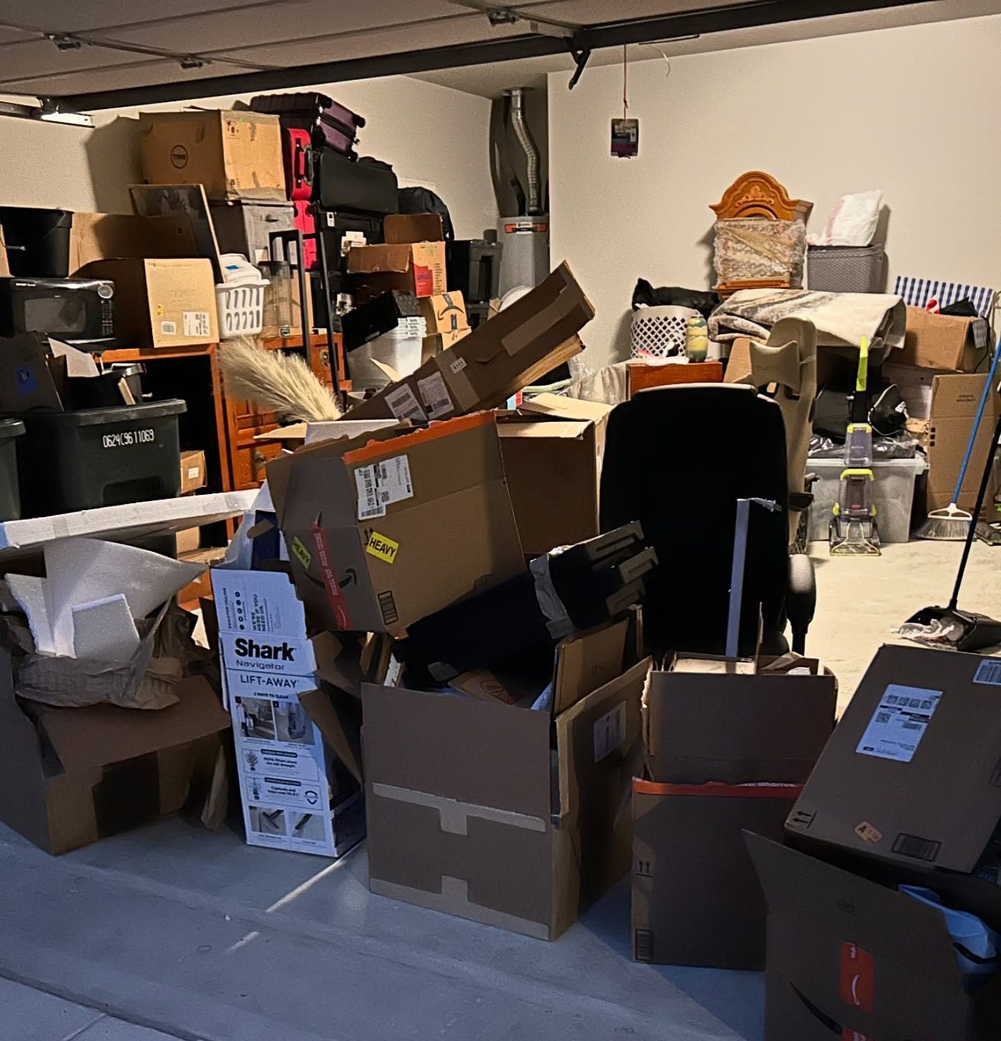 A garage filled with lots of boxes and luggage