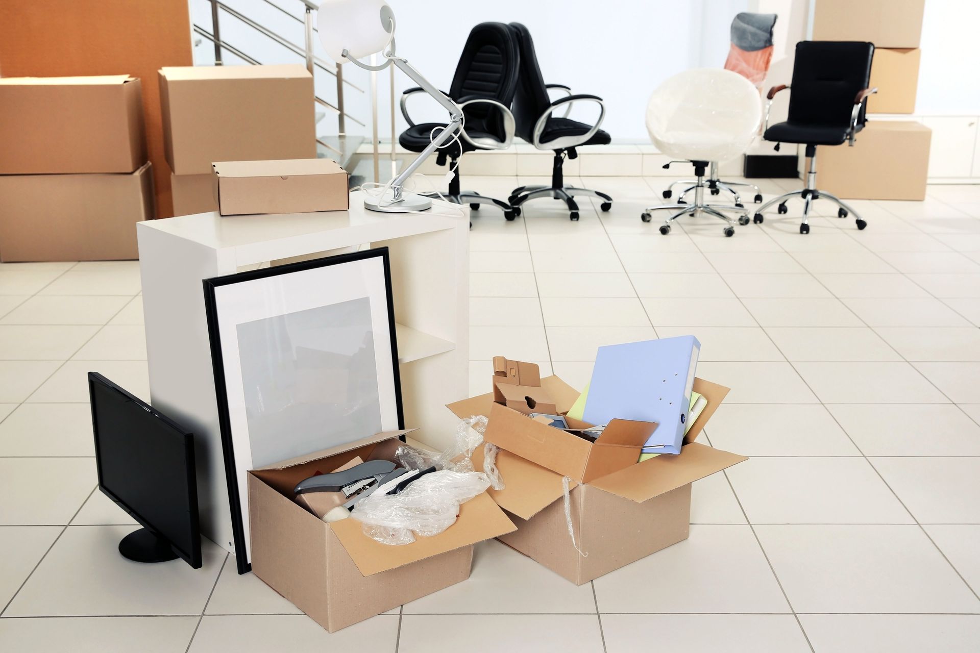 A room filled with boxes and a computer monitor