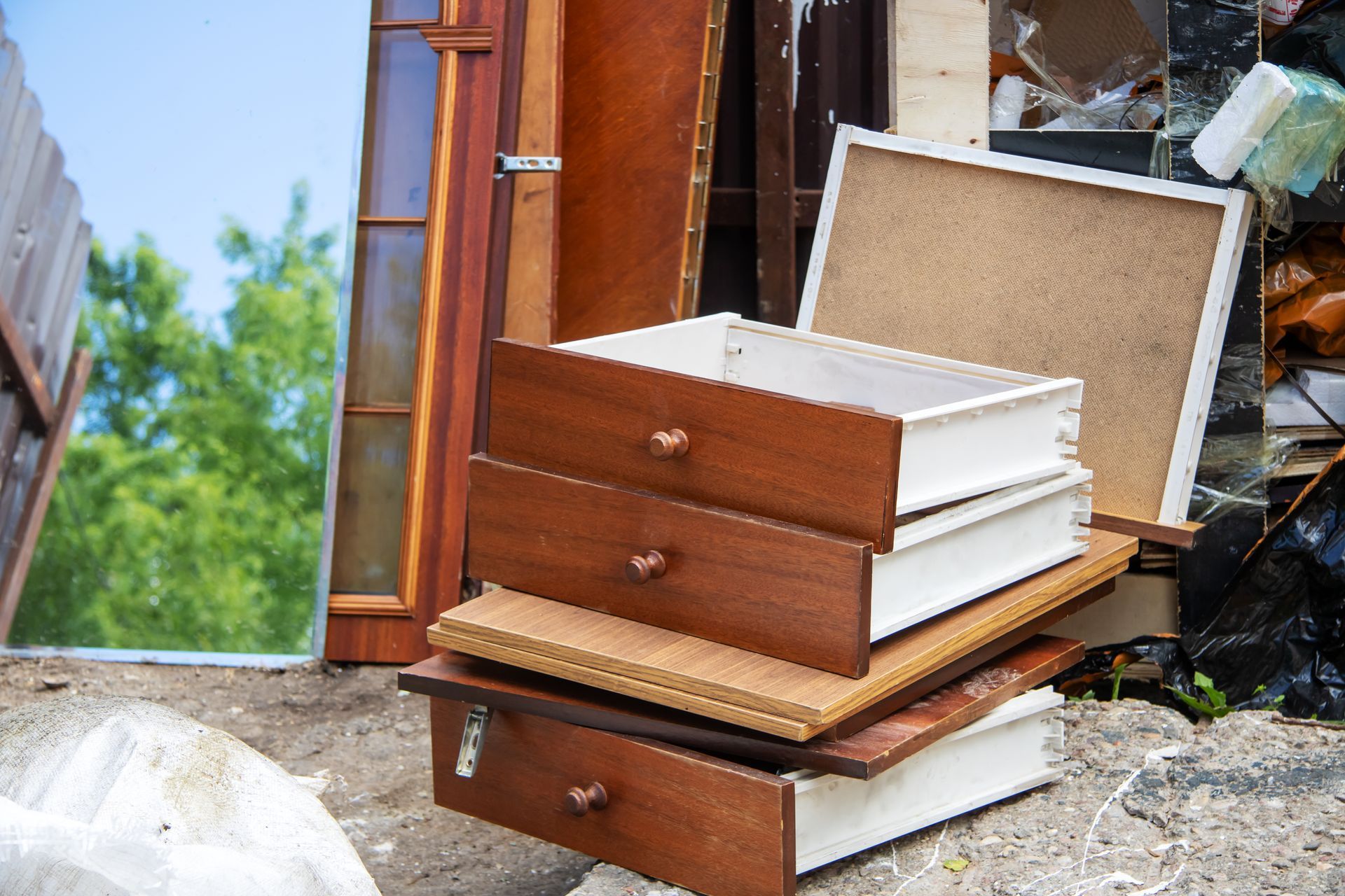 A pile of wooden drawers stacked on top of each other.
