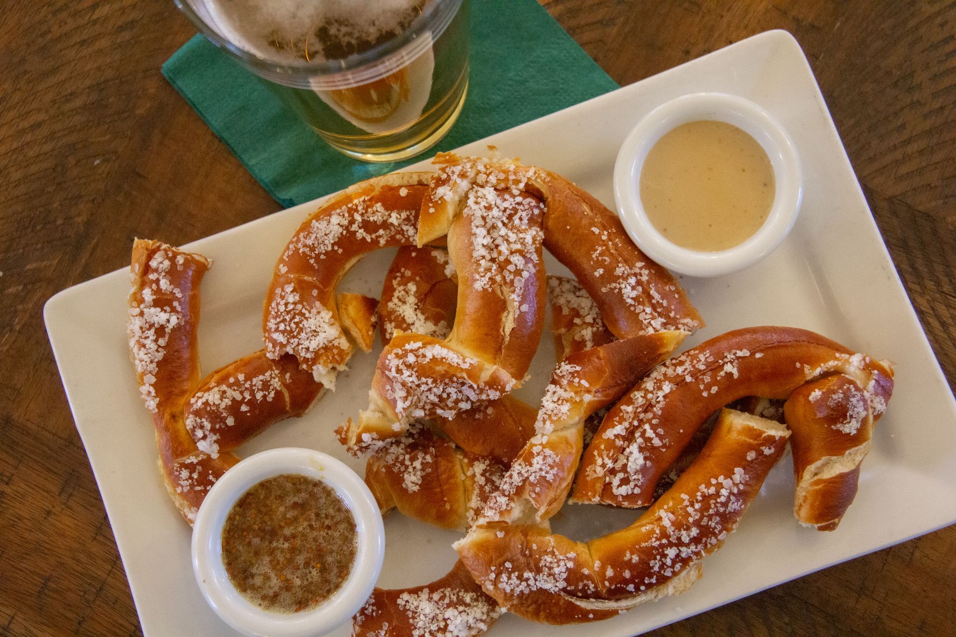 Soft pretzels with mustard and beer.
