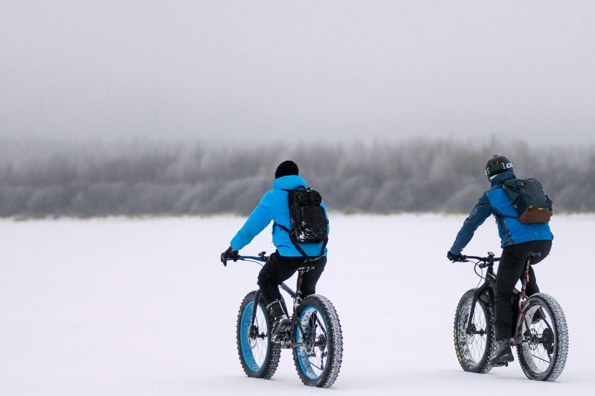 Fat-tire biking on winter trails in the White Mountains near Franconia Inn.