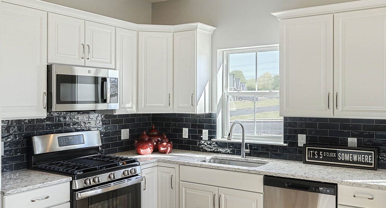 Atworth Kitchen with black tile backsplash at Cortland Park