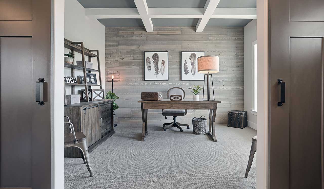 Sliding Barn Door and Coffered Ceiling in Home Office in New Home by Landmark Homes in PA