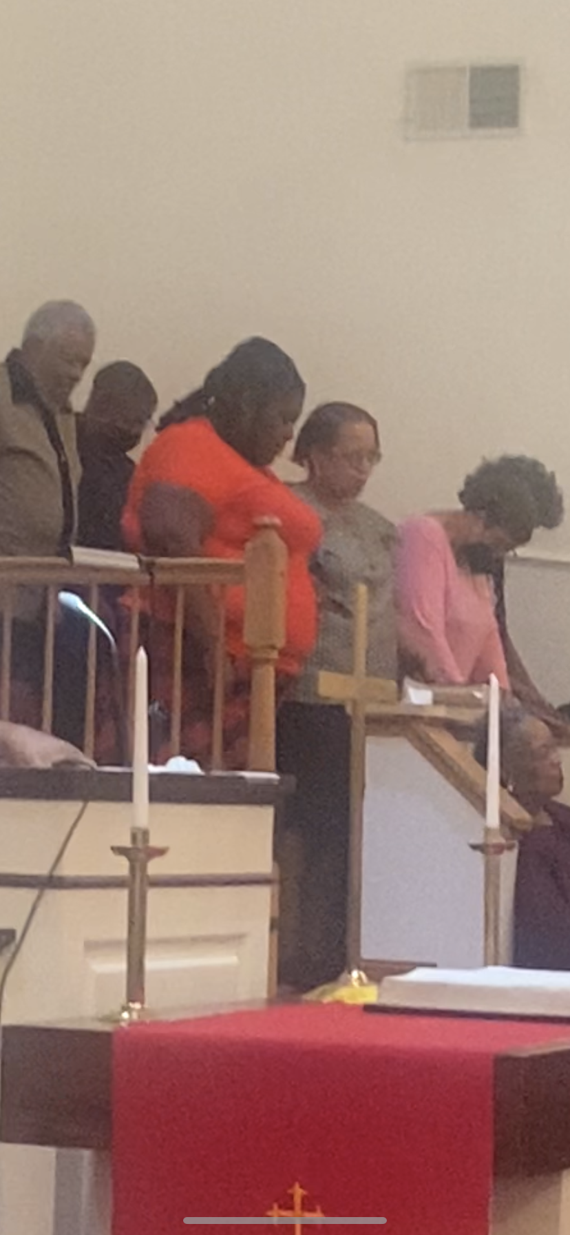 A group of people are sitting in a church.